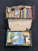 A vintage case and a box containing a quantity of mid twentieth century annuals including Tiger,