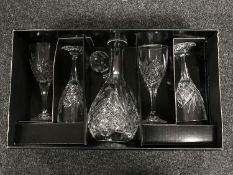 A boxed Royal Doulton crystal decanter together with four wine glasses