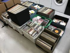 Thirteen boxes containing an extensive collection of LP's, 45's and CDs including rock,