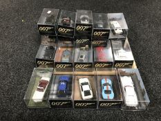 A tray of twenty James Bond die cast vehicles in plastic display cases