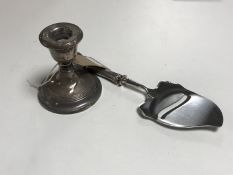 A silver squat candlestick, height 8cm,