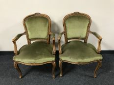 A pair of carved French walnut armchairs