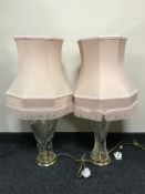 A pair of cut glass table lamps with shades