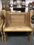 A reclaimed pine pew,