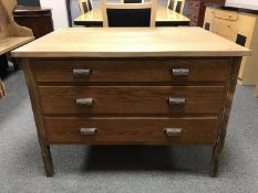 An early 20th century and later oak three drawer chest,