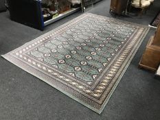 A contemporary woollen rug of Afghan design,