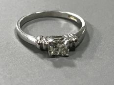 An 18ct white gold princess cut diamond ring, stamped .50pts to shank.