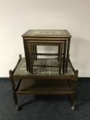 A late 20th century oak coffee table and nest of tables