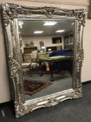 A large silvered bevelled mirror