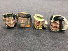 Four large Royal Doulton character jugs - The CLown, Bacchus,