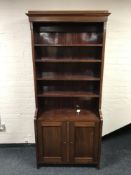 A set of mahogany and pine open shelves