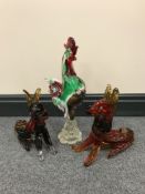 A mid-0th century glass figure of a cockerel and two glass dog figures