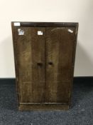 An oak double door record cabinet