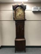 An antique mahogany grandfather clock with painted dial,