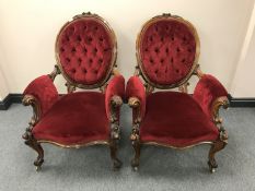 A pair of fine quality Victorian walnut armchairs, upholstered in red velvet, width 72 cm.