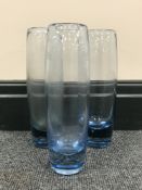 Three Holmegaard Per Lutken blue glass cylindrical vases, height 22 cm.