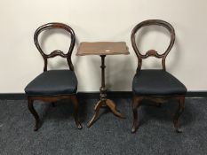 A pair of antique mahogany balloon back chairs together with a mahogany occasional table on