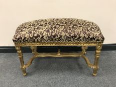 A Louis XV style double dressing table stool, width 93 cm.