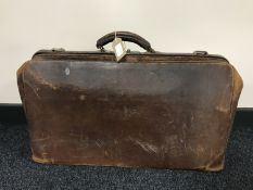 A vintage leather Gladstone bag