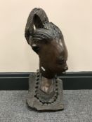 A carved hardwood head of a lady