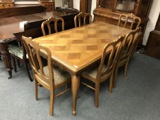 A French oak country dining table 90.5 cm x 160.5 cm, together with six matching chairs.