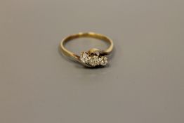 An 18ct gold three stone diamond ring,