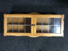 A pine double door wall cabinet