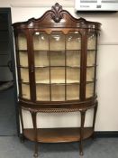 A good quality Georgian style mahogany display cabinet raised on pad feet with under-stretcher,