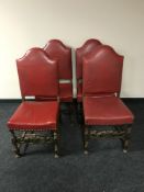 A set of four oak dining chairs in red button leather