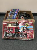 Two boxes of Scalextric track and accessories together with a Rocky Mountain battery operated train