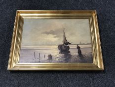 A gilt framed continental oil on canvas - figure at shoreline indistinctly signed