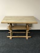 An early 20th century oak dining table