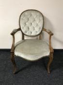 A continental walnut framed armchair