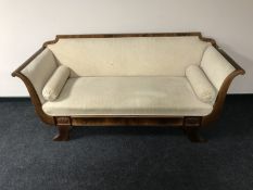 A continental scroll arm settee with two cushions
