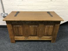 An oak linen fold blanket box