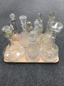 A tray of assorted glass decanters