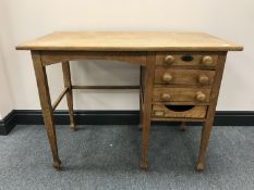 A mid-20th century child's desk fitted four drawers