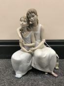 A Lladro figure group,