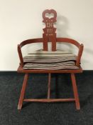 A late 19th century painted elbow chair bearing the initials E.H.