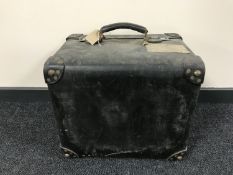 An early 20th century square luggage case