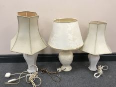 A Royal Creamware luminaries china table lamp with shade together with a pair of table lamps with