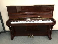 A Steinbach overstrung upright piano in lacquered case,