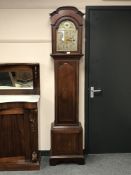 An inlaid mahogany chiming longcased clock with brass and silvered dial