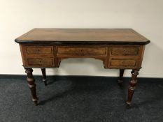 A continental inlaid walnut desk fitted five drawers
