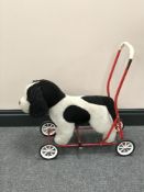 A child's Nylena push along toy (dog)
