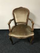 A carved walnut framed armchair