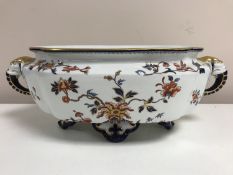 A Royal Worcester gilded planter with elephant twin handles, width 41 cm.