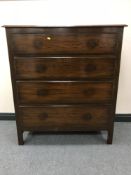 An early 20th century four drawer oak chest