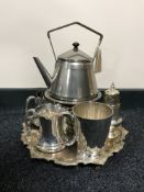 A plated spirit kettle on stand, three tankards,