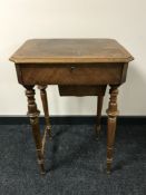A late 19th century walnut work table